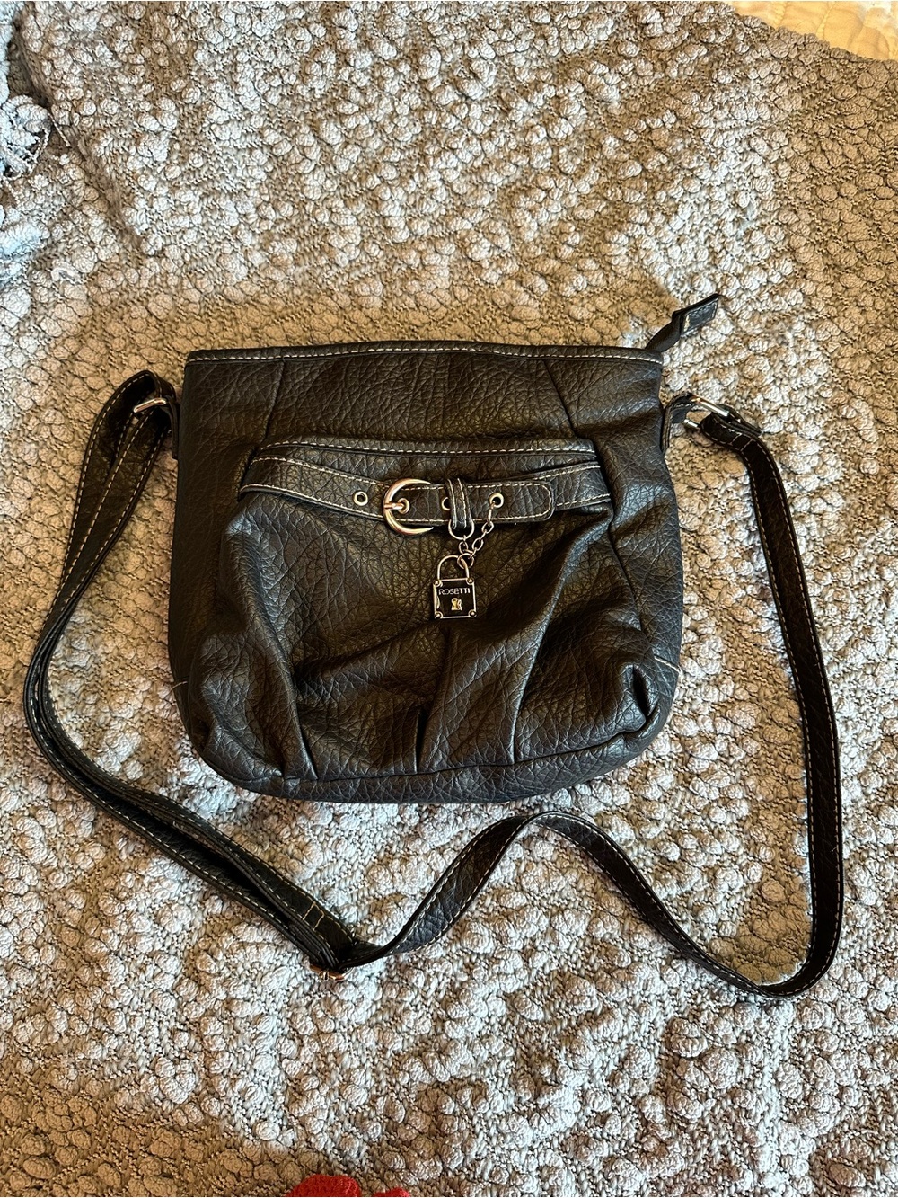 Rosetti Black Blokecore Crossbody Bag with Front Buckle and Charm Accent